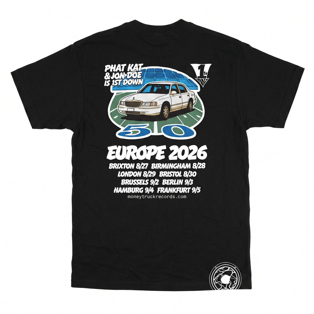 A black short-sleeve graphic t-shirt laid flat against a white background. The shirt features a large front print with a white car, a blue circular design, and text celebrating 'Phat Kat & Ron Doe Is St Down Europe 2026' along with multiple city names and 'Money Truck Records'.